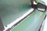Frozzen window of green car