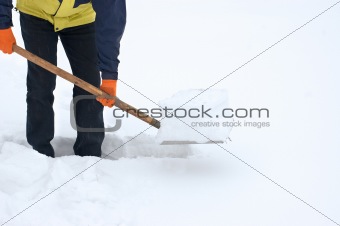 Man digging a path from the snow