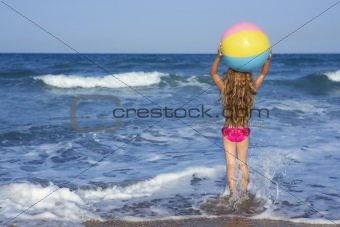 Beach little girl colorful ball playing in vacation