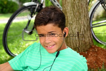 Teen smiling boy hearing music headphones