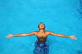 boy teenage relaxed open arms blue swimming pool