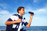 boy teenager binoculars explorer in blue beach