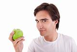 man eating a green apple