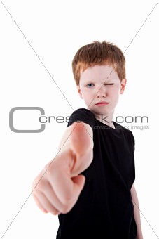 Portrait of a cute young boy, with thumb up