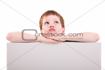 cute  boy looking up with white board