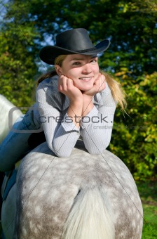 Young Lady riding a horse