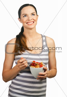 Beautiful young happy woman holding a healthy bowl of cereal