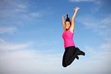 Pretty young woman jumping