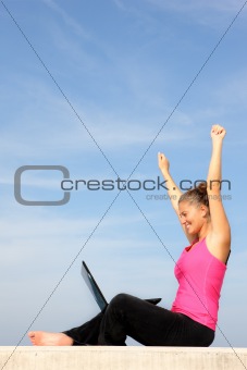 Successful young woman with her laptop