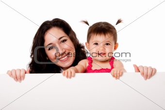 Mother and baby daughter holding white board