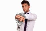 Businessman chained with padlock, job slave symbol, isolated on white background