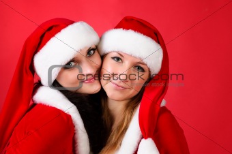 Two girl friends in Christmas costumes