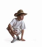 Sitting boy straw hat on white background