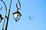 Street lamp and an airliner