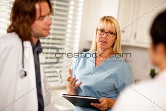 Doctors and Nurses Having A Casual Conversation in The Office.