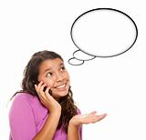 Hispanic Teen Aged Girl on Cell Phone with Blank Thought Bubble Isolated on a White Background - Contains Clipping Paths.