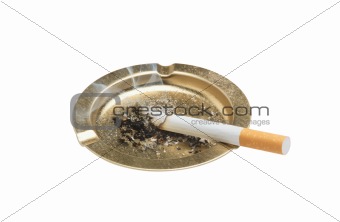 Cigarette and ashtray isolated on white background