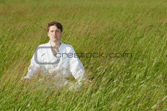 Man sits in grass