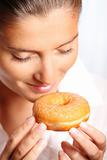 Young woman with a donut