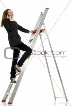 young businesswoman with cellphone on a ladder on white background studio