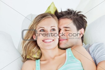 Loving yog couple lying on a sofa