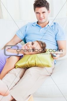 young couple. woman lying on the mans leg
