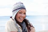 Attractive young woman is cold and wearing a hat 