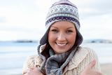 Beautiful young woman is cold and wearing a hat 