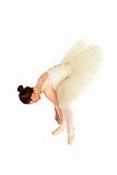 Ballet dancer tighten her dancing shoes over white background