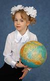 Schoolgirl with geographic globe
