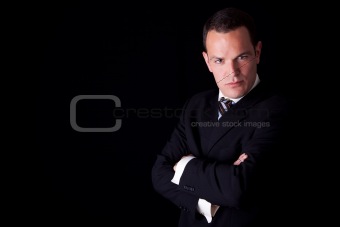 Portrait of a  business man isolated on black background. Studio shot.
