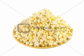pop corn in caramel syrup on yellow plate isolated on white