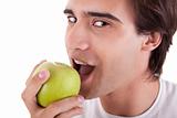 man eating a green apple, isolated on white background. Studio shot.