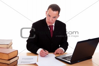 businessman on desk with books and computer, working, isolated on white background, studio shot.