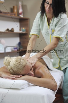 woman at spa and wellness back massage