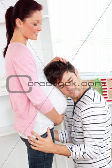 Portrait of an affectionate man with head on his pregnant woman'