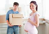Couple expecting a baby and moving to new house