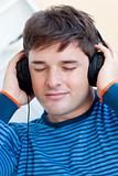 portrait of a caucasian man listening music closing his eyes