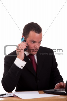 businessman setting a desk talking on the phone, isolated on white background. Studio shot.