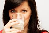 young caucasian woman with glass of milk