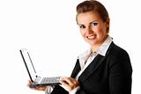 smiling modern business woman holding laptop in hand
