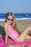 Trendy fashion little summer girl on beach