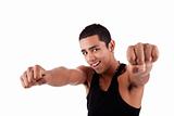 Portrait of a very happy  young latin man with his arms raised, on white background. Studio shot