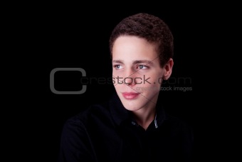 cute boy, smiling on black, studio shot