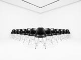 Black Chairs in a white room