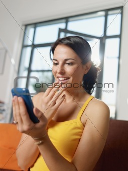 amazed woman holding cellphone