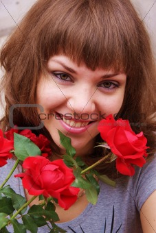 young girl  with bright roses
