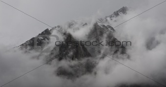Mountain top shrouded in clouds