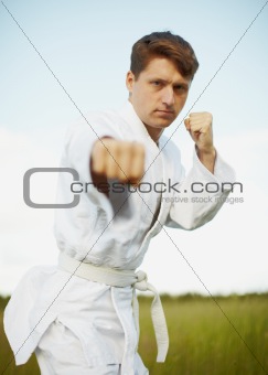 Young man is engaged in karate