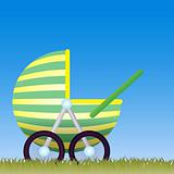 Baby Carriage on the meadow with the blue sky behind.